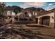 Elegant desert home with a three-car garage, stone accents, and meticulous landscaping at 25572 N 113Th Way, Scottsdale, AZ 85255