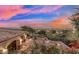 Sunset view from home with a large curved driveway, desert landscape and decorative outdoor lighting at 25572 N 113Th Way, Scottsdale, AZ 85255