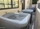 Outdoor shot of three AC units on gravel between building and stairs at 25572 N 113Th Way, Scottsdale, AZ 85255