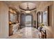 Grand foyer boasts detailed ceiling work, stone floors, and arched doorways with views at 25572 N 113Th Way, Scottsdale, AZ 85255