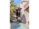 Inviting front entrance with lush tropical landscaping and tranquil water feature enhancing curb appeal at 25572 N 113Th Way, Scottsdale, AZ 85255