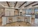 Gourmet kitchen featuring custom cabinets, granite countertops, stainless steel appliances and large island with seating at 25572 N 113Th Way, Scottsdale, AZ 85255