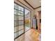 Bright living space featuring wood floors, elegant trim, and a sliding door with scenic backyard views at 25572 N 113Th Way, Scottsdale, AZ 85255