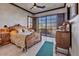 Elegant main bedroom with luxurious bedding and scenic window view at 25572 N 113Th Way, Scottsdale, AZ 85255