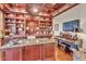 Executive office with custom built-ins, granite counters, and a cozy piano area at 25572 N 113Th Way, Scottsdale, AZ 85255
