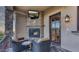 Cozy outdoor fireplace and seating area for relaxing evenings at 25572 N 113Th Way, Scottsdale, AZ 85255