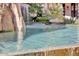 Inviting pool with clear water and natural rock features for a luxurious backyard experience at 25572 N 113Th Way, Scottsdale, AZ 85255