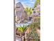 Scenic outdoor living space with lush vegetation and an eye-catching water feature at 25572 N 113Th Way, Scottsdale, AZ 85255