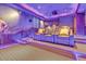 Luxury home theater with plush seating, ambient lighting, and projector setup for ultimate entertainment at 25572 N 113Th Way, Scottsdale, AZ 85255