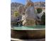 A tiered water feature creating an oasis with rock formations and tranquil waterfall sounds at 25572 N 113Th Way, Scottsdale, AZ 85255