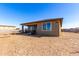 View of the home's backyard with space for outdoor activities and landscaping at 29318 N 224Th Dr, Wittmann, AZ 85361