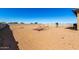 Spacious dirt backyard ready for customization with play area in view at 29318 N 224Th Dr, Wittmann, AZ 85361