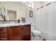 Bathroom featuring granite counters, stylish cabinetry, toilet and shower with curtain at 300 N Gila Springs Blvd # 160, Chandler, AZ 85226