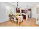 Inviting dining area with a vintage table, seating for six, and ample natural light at 300 N Gila Springs Blvd # 160, Chandler, AZ 85226