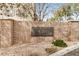 Stone community entrance sign with lush greenery at 300 N Gila Springs Blvd # 160, Chandler, AZ 85226