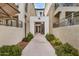 Building exterior featuring walkways, stairs, and verdant landscaping at 300 N Gila Springs Blvd # 160, Chandler, AZ 85226