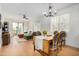 Bright living room with hardwood floors, modern furnishings, and access to a private balcony at 300 N Gila Springs Blvd # 160, Chandler, AZ 85226