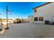 Large open backyard featuring basketball hoop, outdoor kitchen, and white fencing at 31301 N Sunflower Way, San Tan Valley, AZ 85143