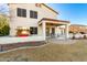 Spacious backyard with covered patio, swing set, and exterior views of the home at 31301 N Sunflower Way, San Tan Valley, AZ 85143