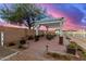 Outdoor patio featuring a pergola with string lights, perfect for evening gatherings at 31301 N Sunflower Way, San Tan Valley, AZ 85143