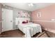 Charming bedroom decorated with flowers and accented by a plush bed and natural light at 31301 N Sunflower Way, San Tan Valley, AZ 85143