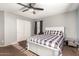 Bedroom featuring a white bed frame, window, and sliding door closet at 31301 N Sunflower Way, San Tan Valley, AZ 85143