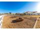 Equestrian area with a brick fire pit, white fence, and access to the backyard at 31301 N Sunflower Way, San Tan Valley, AZ 85143