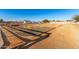 Well-maintained equestrian area with white fencing, defined sections, and gravel paths at 31301 N Sunflower Way, San Tan Valley, AZ 85143