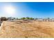 Expansive equestrian area with white fencing, offering ample space for training and recreation at 31301 N Sunflower Way, San Tan Valley, AZ 85143