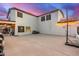 Two-story home exterior with large backyard patio and basketball hoop at 31301 N Sunflower Way, San Tan Valley, AZ 85143