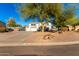 Spacious two-story home with a three-car garage, desert landscaping, and a circular driveway at 31301 N Sunflower Way, San Tan Valley, AZ 85143
