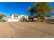 Spacious two-story home featuring a three-car garage and ample driveway space at 31301 N Sunflower Way, San Tan Valley, AZ 85143