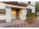 Inviting front entrance with decorative door, sconce, and manicured landscaping at 31301 N Sunflower Way, San Tan Valley, AZ 85143