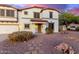 Inviting home with a paver pathway, desert landscaping, and a covered front porch at 31301 N Sunflower Way, San Tan Valley, AZ 85143