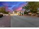 Stately two-story home with a large driveway, desert landscaping, and a three-car garage at 31301 N Sunflower Way, San Tan Valley, AZ 85143