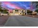 Beautiful two-story home with a spacious driveway, well-manicured landscaping, and a grand entrance at 31301 N Sunflower Way, San Tan Valley, AZ 85143