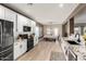 Bright kitchen with white cabinetry, granite countertops, and modern appliances, creating an inviting cooking space at 31301 N Sunflower Way, San Tan Valley, AZ 85143