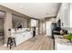 Open kitchen featuring white cabinets, granite countertops, and modern black appliances at 31301 N Sunflower Way, San Tan Valley, AZ 85143