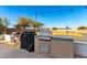 Outdoor kitchen with stainless steel grill, countertop, and string lights at 31301 N Sunflower Way, San Tan Valley, AZ 85143