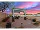 Outdoor patio area with a pergola, brick flooring, and a serene fenced yard, perfect for relaxation at 31301 N Sunflower Way, San Tan Valley, AZ 85143