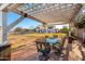 Covered patio with outdoor seating and a view of the large backyard at 31301 N Sunflower Way, San Tan Valley, AZ 85143