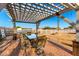 Covered patio with outdoor seating, brick pavers, and views of the equestrian area at 31301 N Sunflower Way, San Tan Valley, AZ 85143