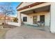 Inviting covered patio with a ceiling fan and seating, perfect for relaxing outdoors at 31301 N Sunflower Way, San Tan Valley, AZ 85143