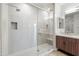 Walk-in shower with glass door enclosure, stone bench, and double-sink vanity outside at 3233 N 70Th St # 1006, Scottsdale, AZ 85251