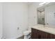 Bright bathroom featuring a modern vanity with stone countertop and tiled shower behind a glass door at 3233 N 70Th St # 1006, Scottsdale, AZ 85251