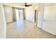 Spacious primary bedroom with a ceiling fan, large windows, and sliding door leading to a balcony at 3233 N 70Th St # 1006, Scottsdale, AZ 85251