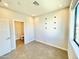 Empty bedroom with a large window for natural light and an ensuite bathroom at 3233 N 70Th St # 1006, Scottsdale, AZ 85251