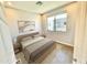 Bright bedroom featuring a large window, neutral decor, and comfortable furnishings at 3233 N 70Th St # 1006, Scottsdale, AZ 85251