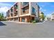 Contemporary townhome showcasing brick accents, private balconies, and multiple garage doors at 3233 N 70Th St # 1006, Scottsdale, AZ 85251