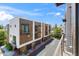 Modern townhome exterior with brick accents, garage, and manicured landscaping at 3233 N 70Th St # 1006, Scottsdale, AZ 85251